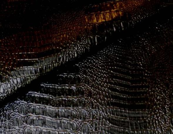 Closeup folded image of Faux Alligator Color Black in stock vinyl Fabric