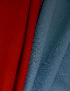 Draped curtain image of pattern Wrangler, colors Aegean Off Color and Paprika Off Color, premium multipurpose interior design fabrics