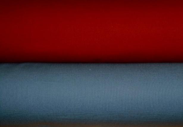 Rolls of Cotton Solid Plain Decorating Fabrics pattern Wrangler, colors Aegean Off Color and Paprika Off Color