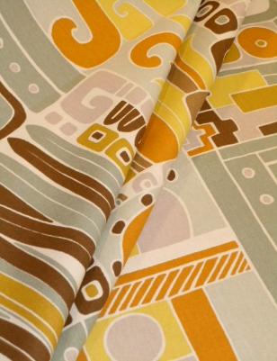 Draped curtain image of Pattern Hola Color Terra screen print on medium weight cotton duck home decorating fabric